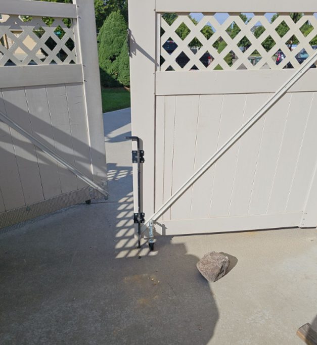 The vinyl gate rehung and latching